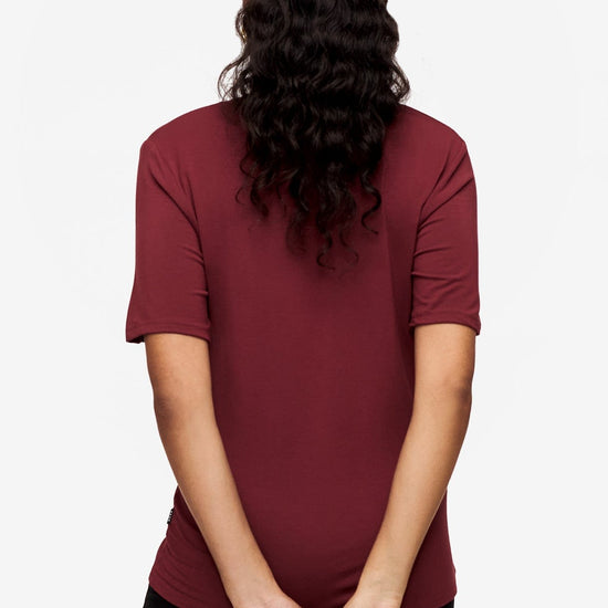 back of a woman wearing deep red v-neck short sleeve t-shirt