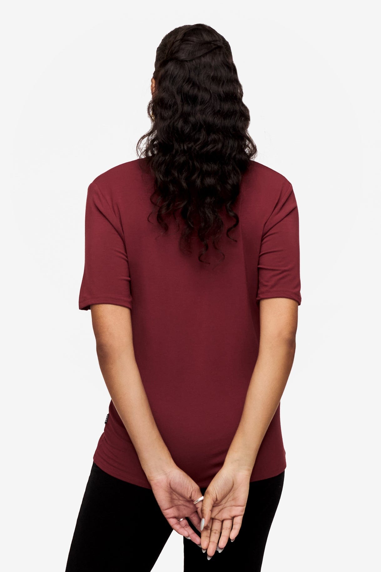 back of a woman wearing deep red v-neck short sleeve t-shirt