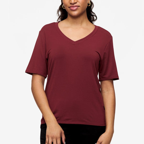 woman wearing deep red v-neck short sleeve t-shirt