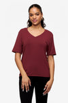 woman wearing deep red v-neck short sleeve t-shirt