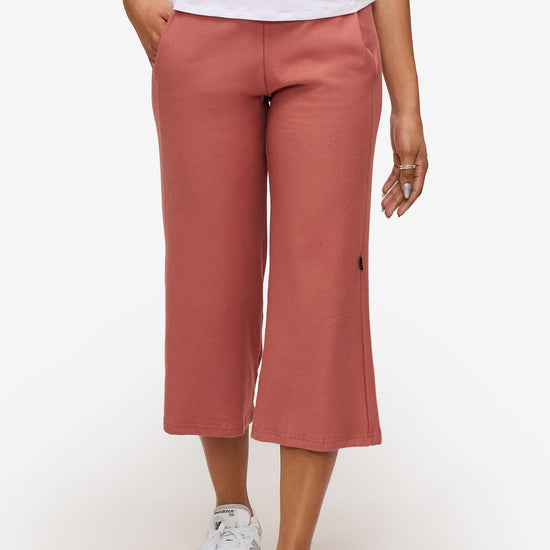 woman wearing orange cropped sweatpants 