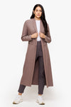 woman wearing a long front open jacket in beige