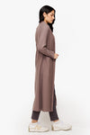 side of a woman wearing a long front open jacket in beige