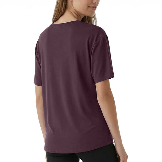 Woman wearing a purple t-shirt on a white background