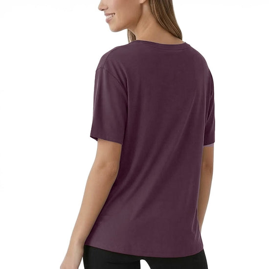 Woman wearing a purple t-shirt on a white background