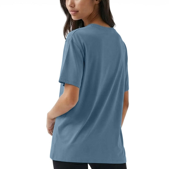 Woman wearing a blue t-shirt on a white background