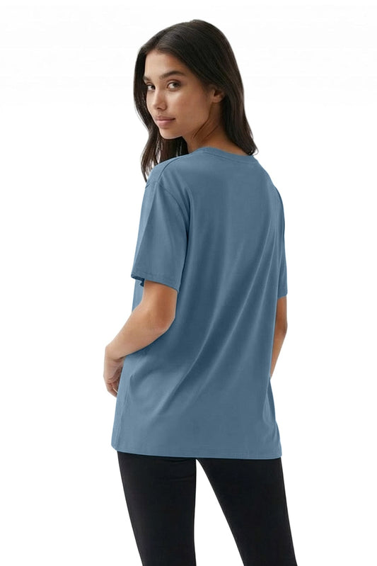 Woman wearing a blue t-shirt on a white background