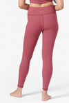 back view of a woman wearing ribbed pink leggings