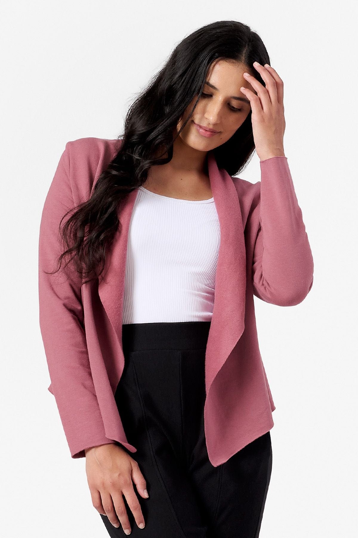 Woman smiling wearing a pink jacket