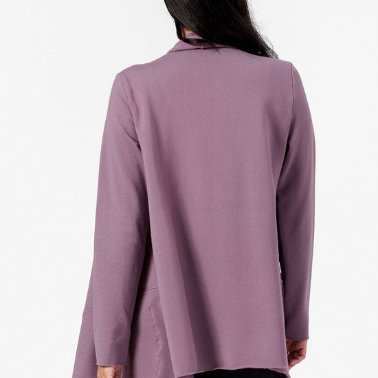 back view of a woman wearing a purple loose jacket