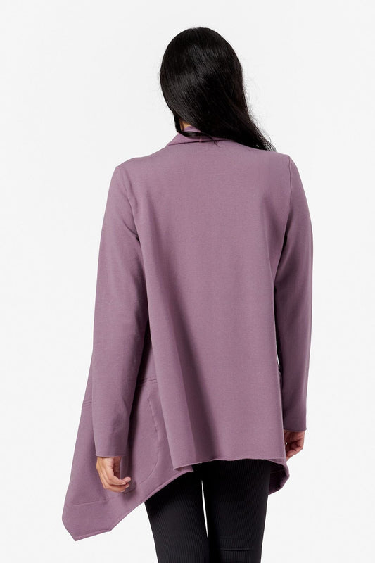 back view of a woman wearing a purple loose jacket