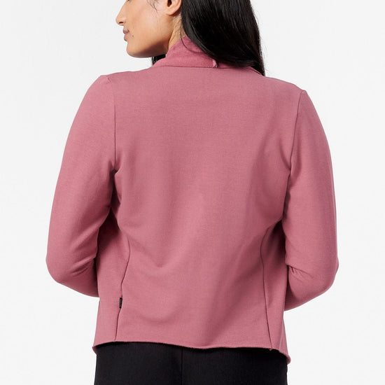 Back of a woman wearing a pink Jacket 