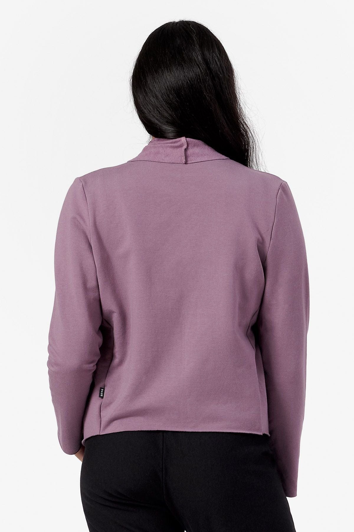 Back of a woman wearing a purple jacket