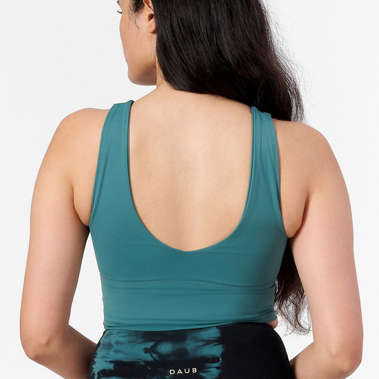 back view of a woman wearing a low back reversible sports bra