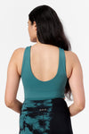 back view of a woman wearing a low back reversible sports bra