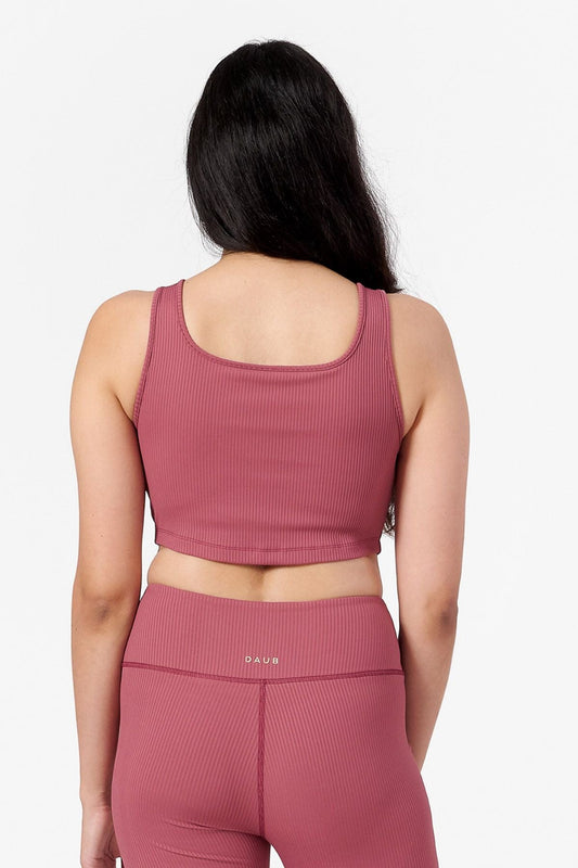 back of woman wearing a square neck ribbed cropped tank top in pink