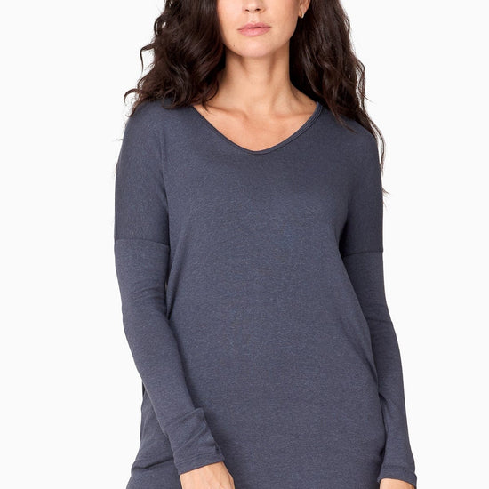 Woman wearing a blue long sleeve sweater 