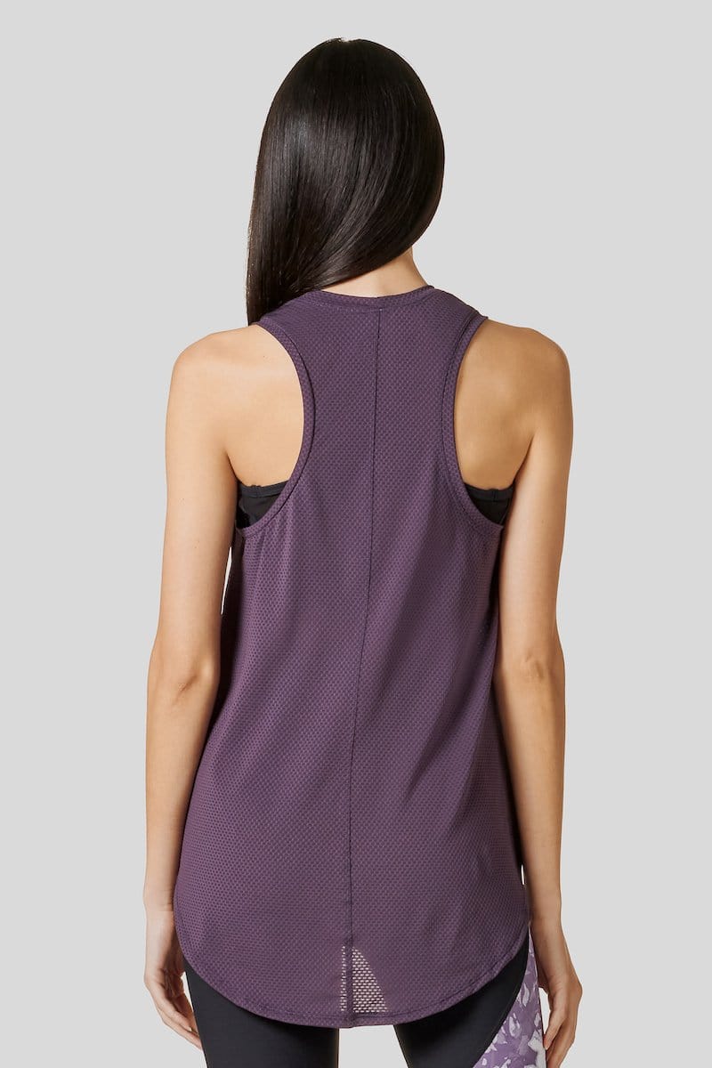 Back of woman wearing a Deep Purple Alex Tank paired with the Signature Legging in Fig