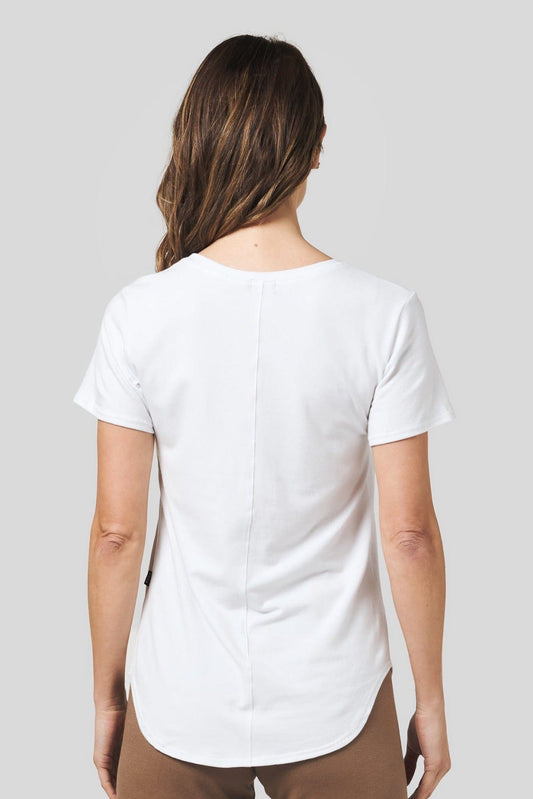 Back of a women wearing a white short sleeve tee and brown sweatpants