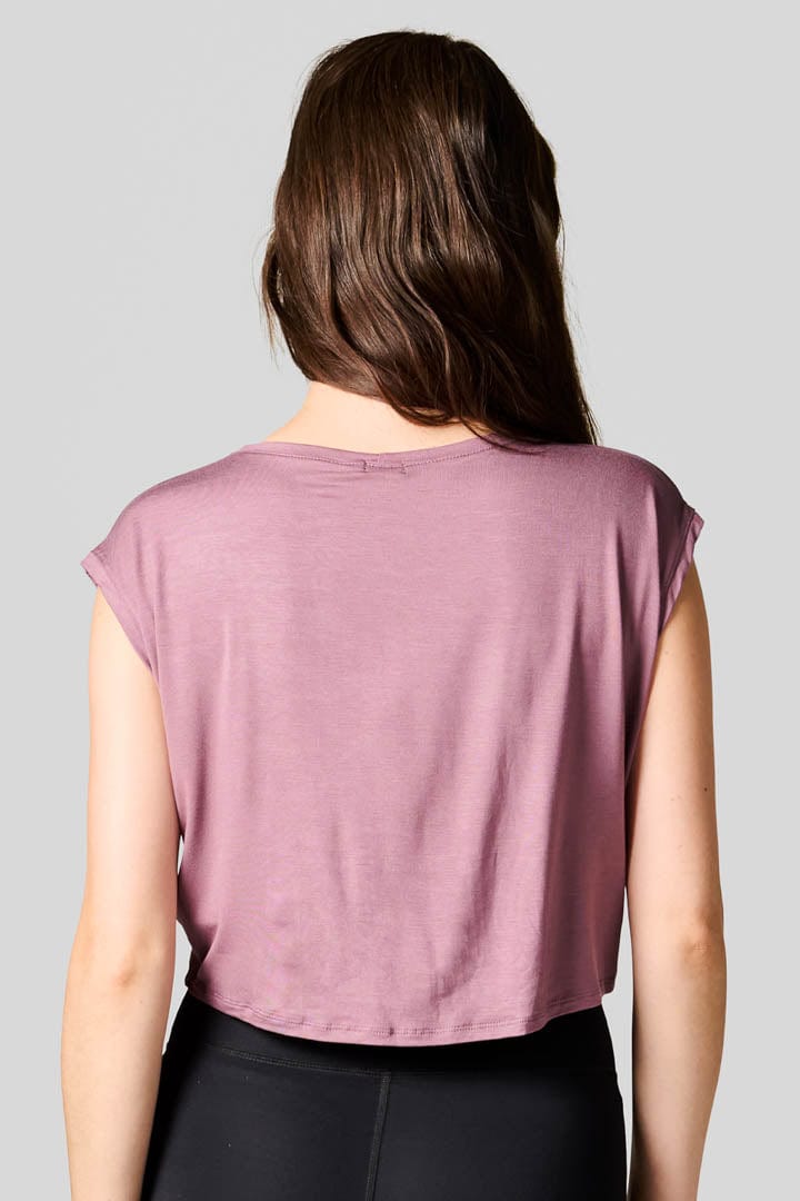 Back of a woman wearing a  pink tee