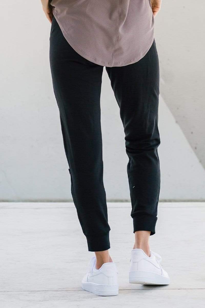 Woman wearing comfortable dressy lounge sweatpants in black made with sustainable fabrics for sustainable made-in-Canada joggers.