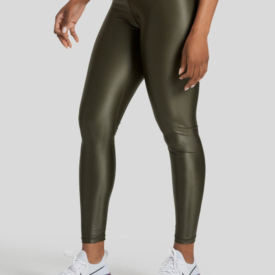 A woman's legs are shown wearing liquid olive colored leggings