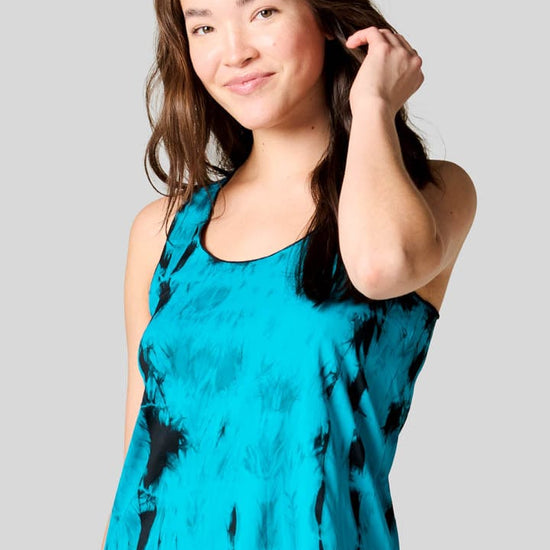 Women wearing a blue tie dye tank top.