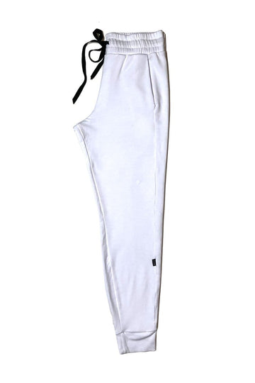 White dressy joggers folded in half with a black drawstring