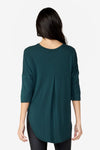 back of a Woman wearing a green 3/4 length tee.