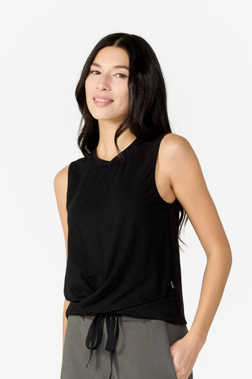 Woman in basic black cropped tank top made of OEKO-TEX fabric ethically-made in Canada basics and black workout sets.