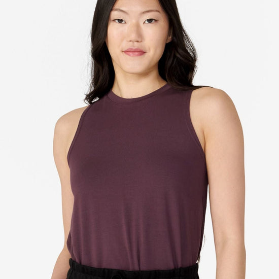 girl front view wearing a dark brown tank top