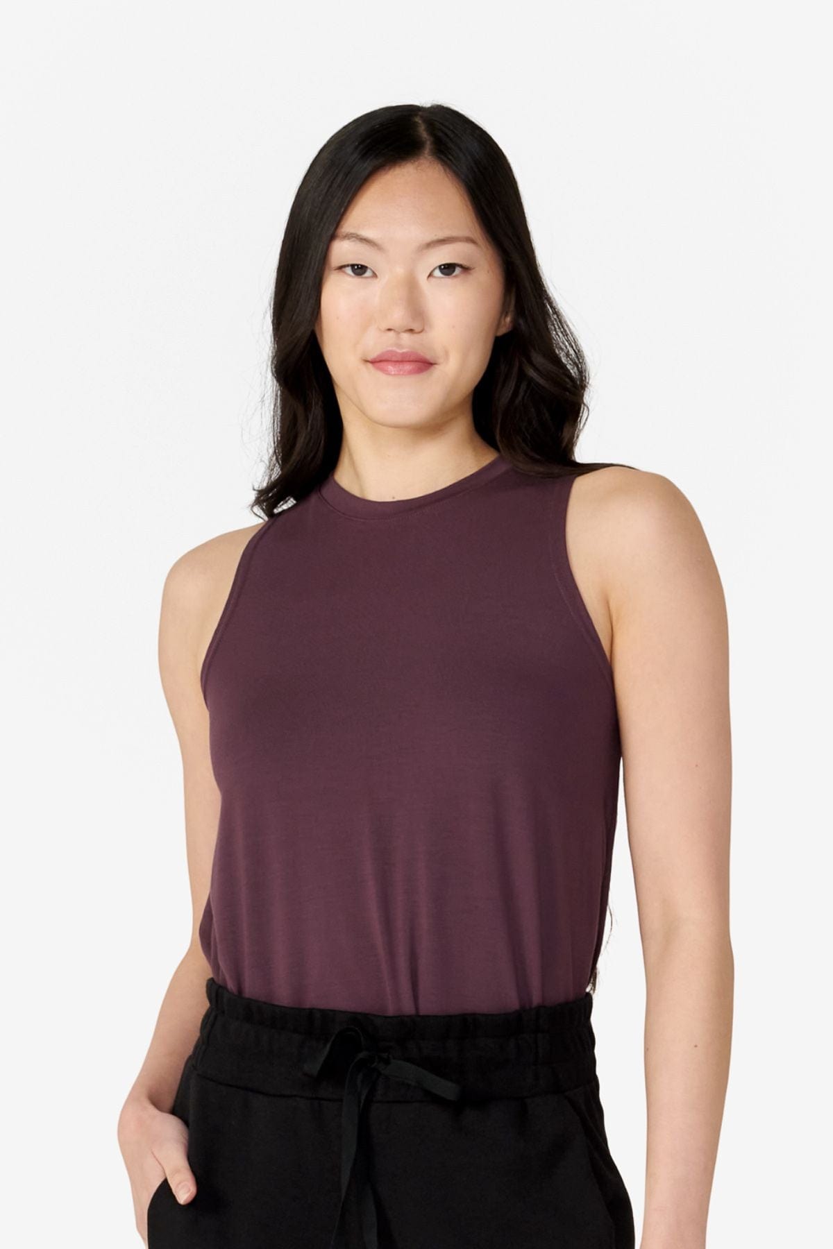 girl front view wearing a dark brown tank top